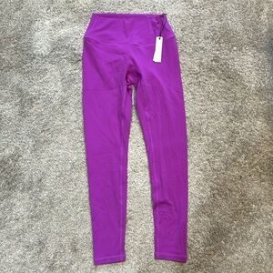 Pink size medium paragon leggings. never worn with tag still attached.